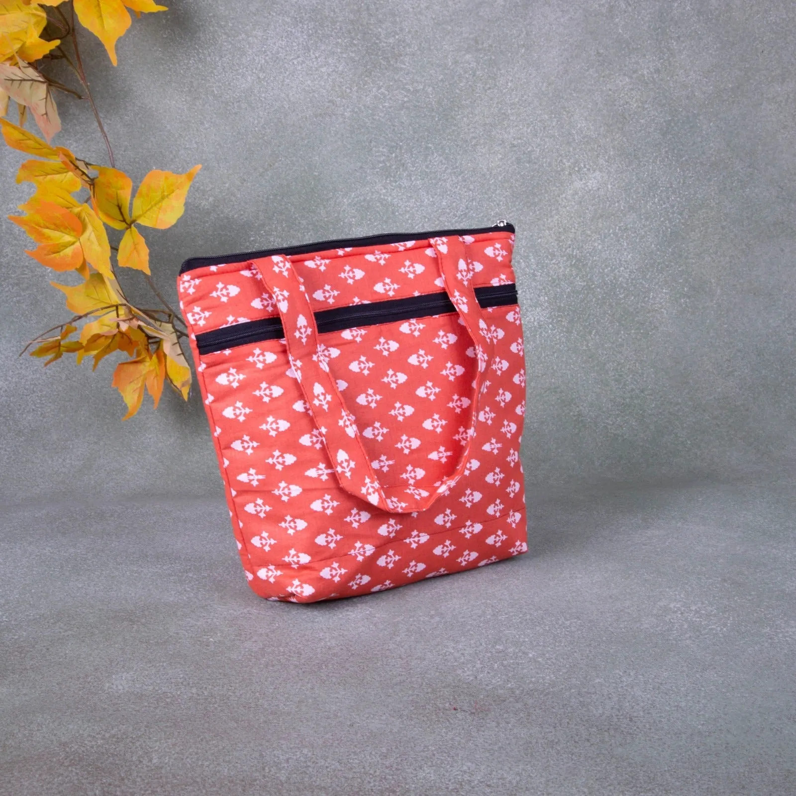 Small Handbag Orange Colour with White Small Prints.